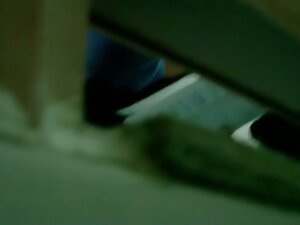 Bathroom spy cam video of Asian girl reading while pissing