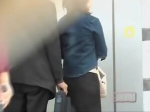 Business man attached his bag to her for skirt sharking.